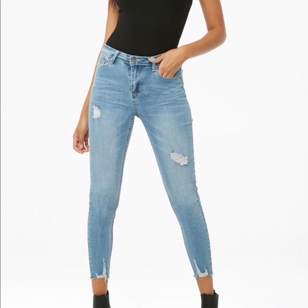 Distressed light wash denim skinny jeans
